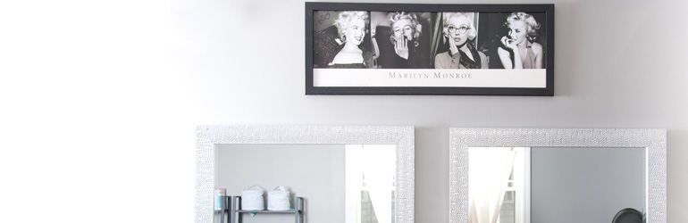 detail of wall with mirrors and marilyn monroe photos